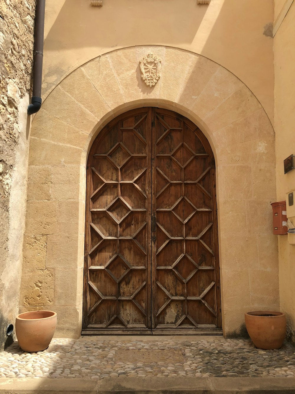 a large wooden door in a stone building