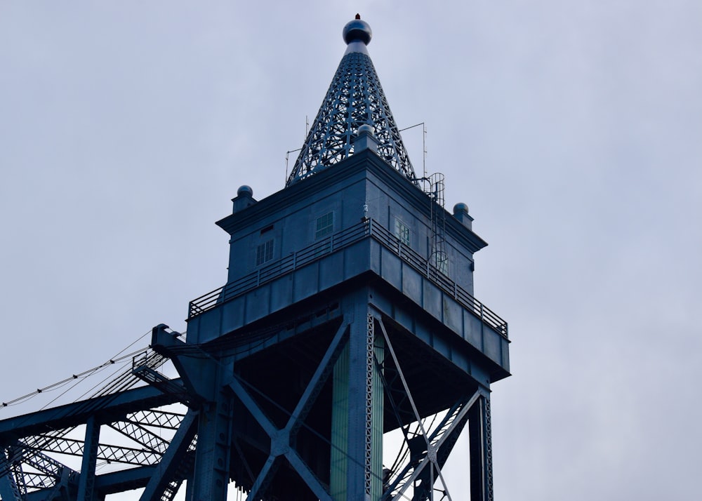 a tall tower with a clock on the top of it