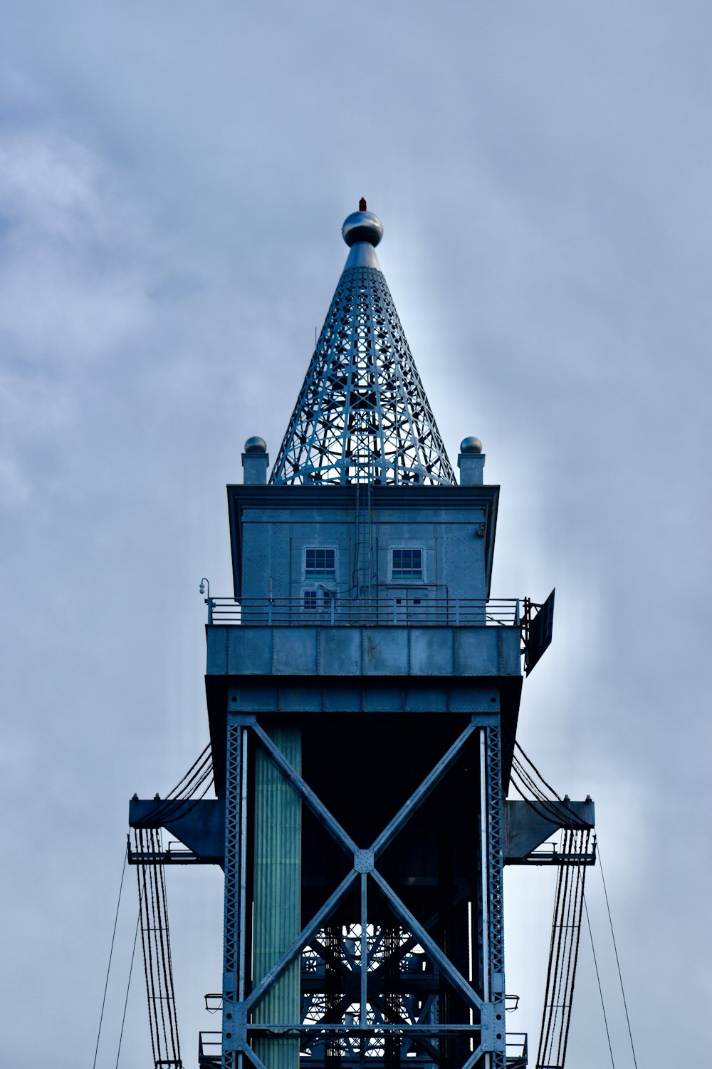 a tall tower with a clock on the top of it