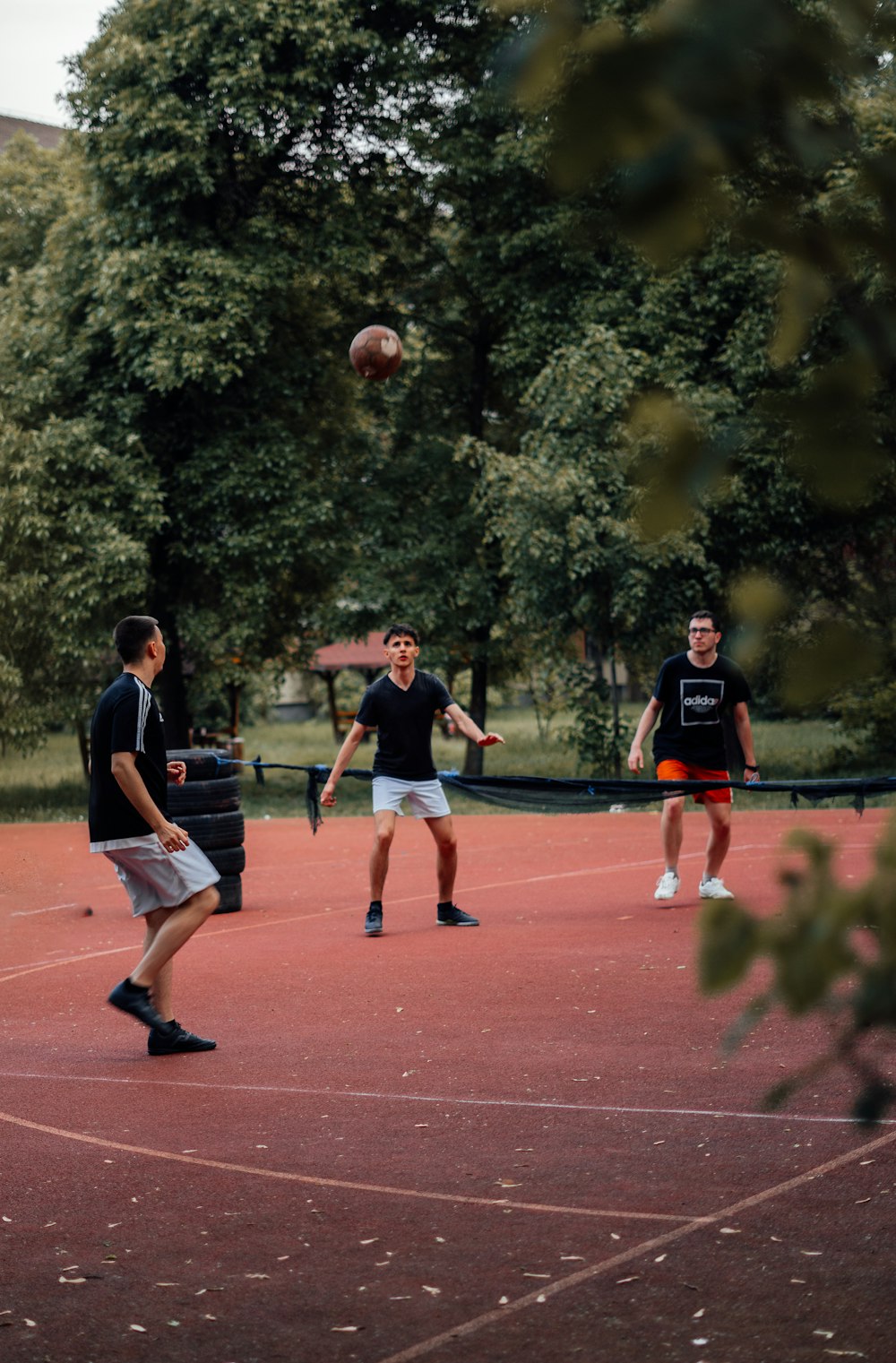 a group of young men playing a game of frisbee