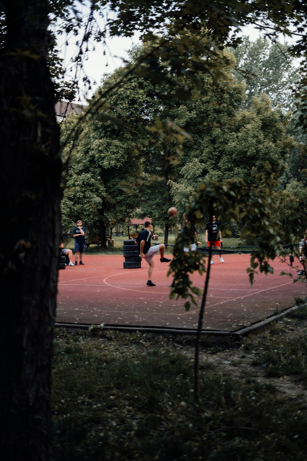 a group of people playing a game of basketball