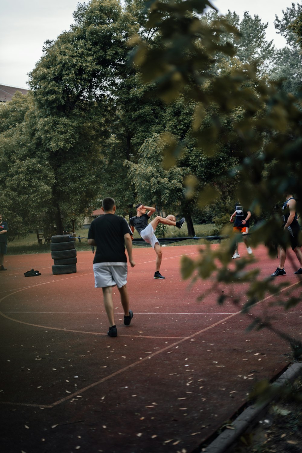 a group of people playing a game of tennis