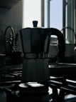 A stylish Romano Electric coffee maker brewing fresh coffee in a sunlit kitchen