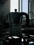 A stylish Romano Electric coffee maker brewing fresh coffee in a sunlit kitchen