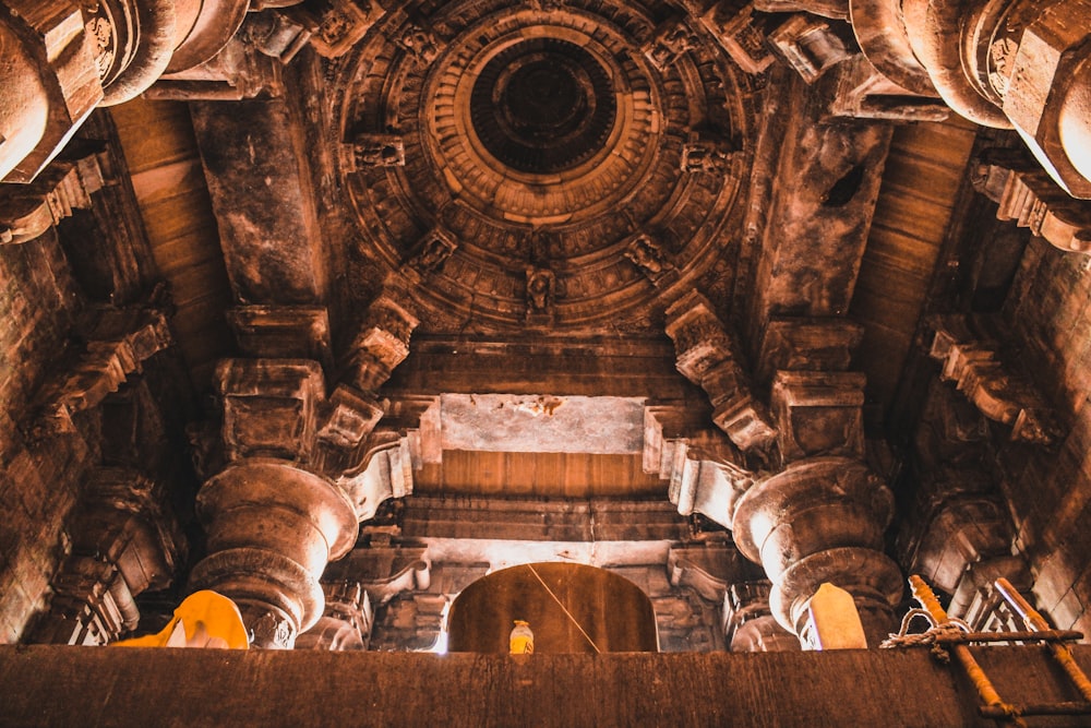 the ceiling of a large building with columns