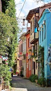 a cobblestone street lined with colorful buildings
