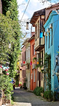 a cobblestone street lined with colorful buildings