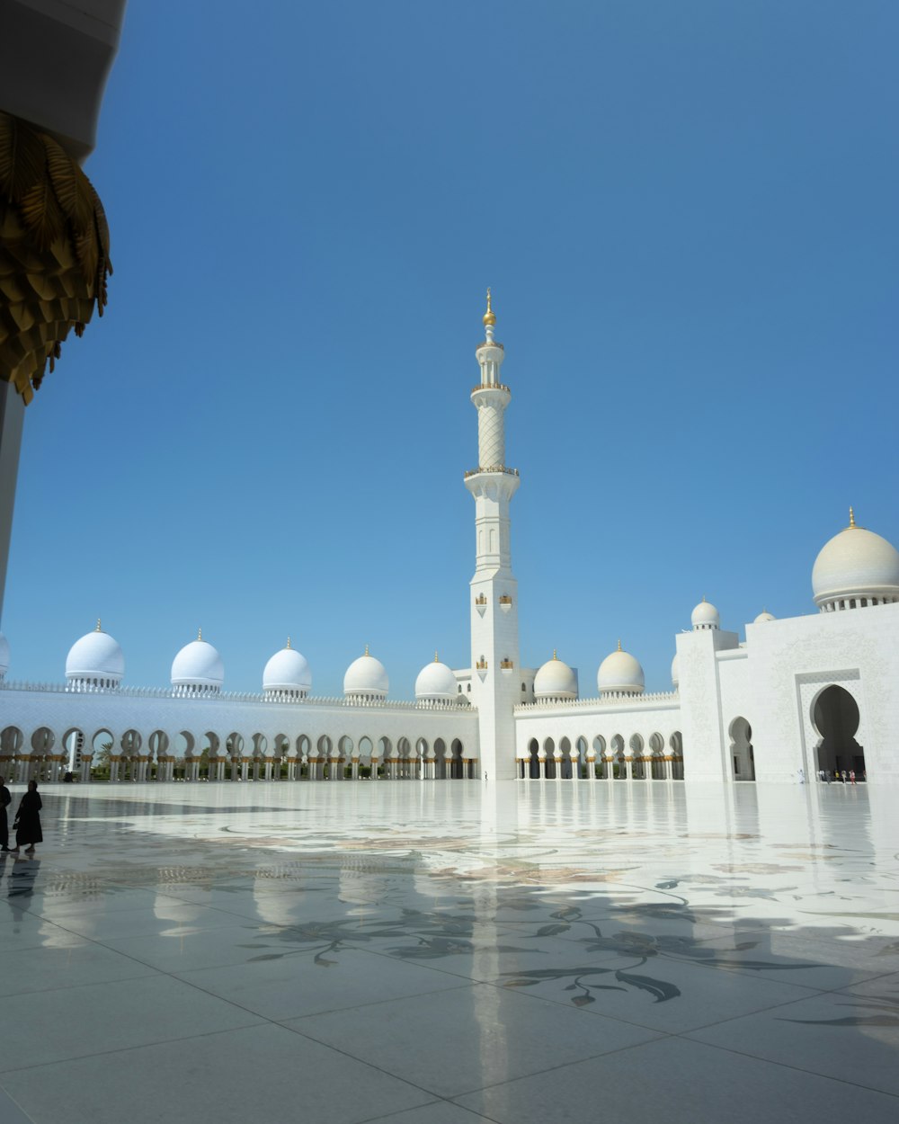 a large white building with a tall tower