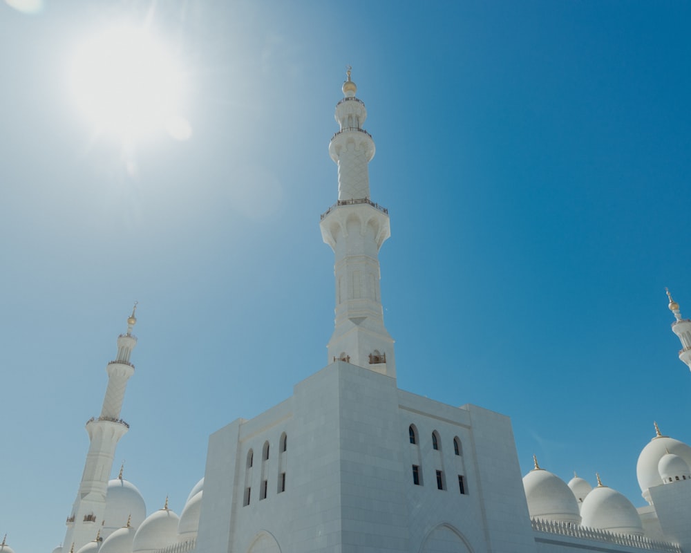 a large white building with a tall tower