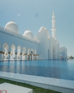 An elegant masjid featuring intricate Islamic design elements and serene surroundings