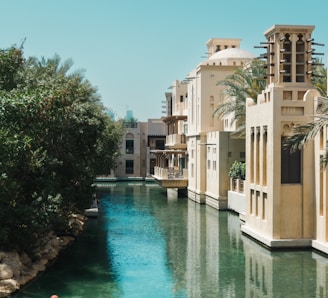 a river running through a city next to tall buildings