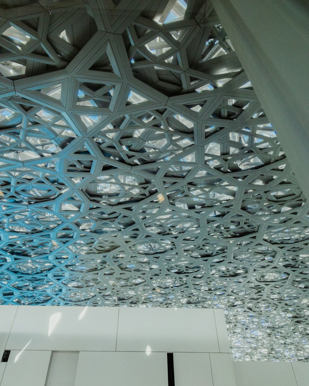 the ceiling of a building with a pattern on it