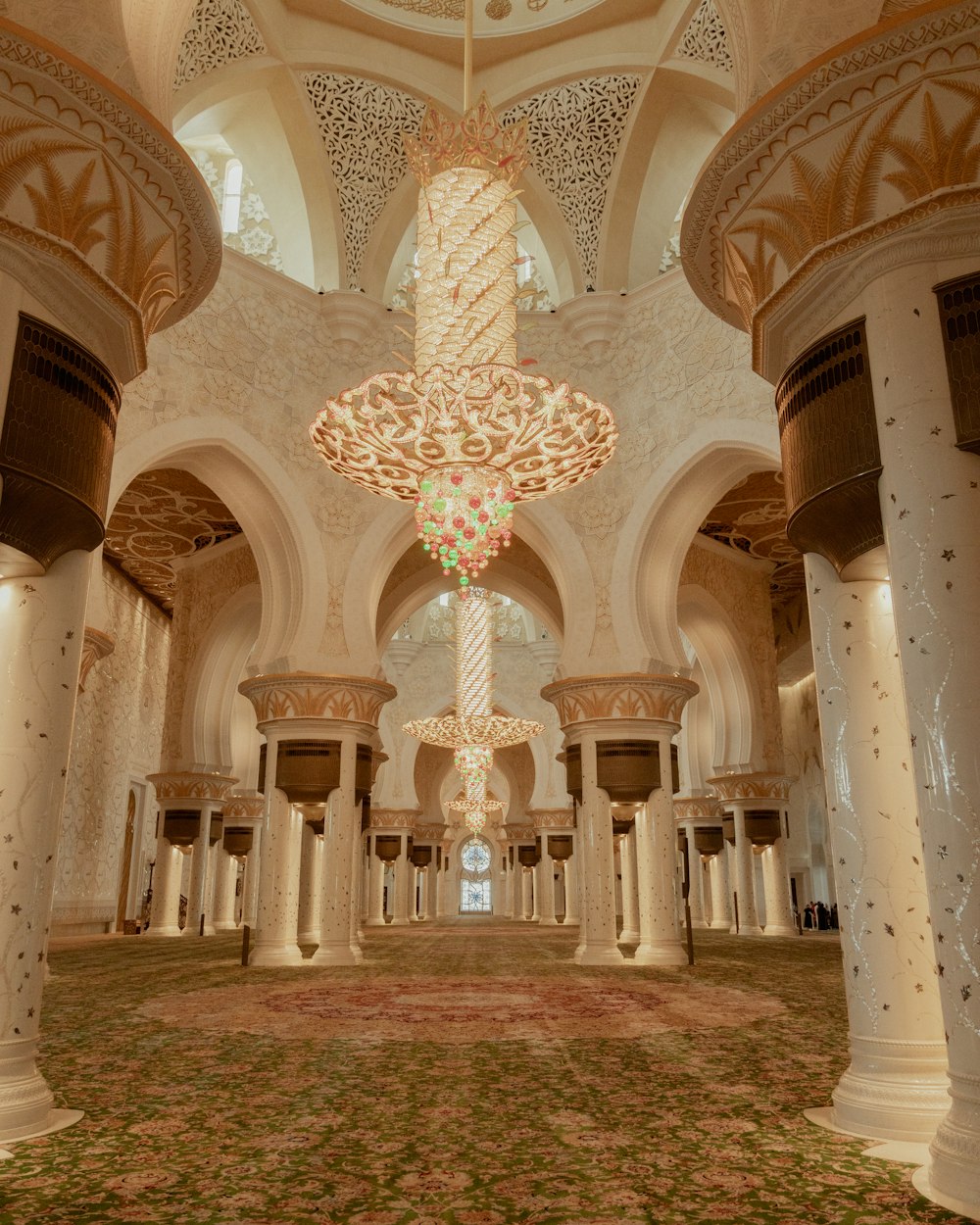 a large room with a chandelier hanging from the ceiling