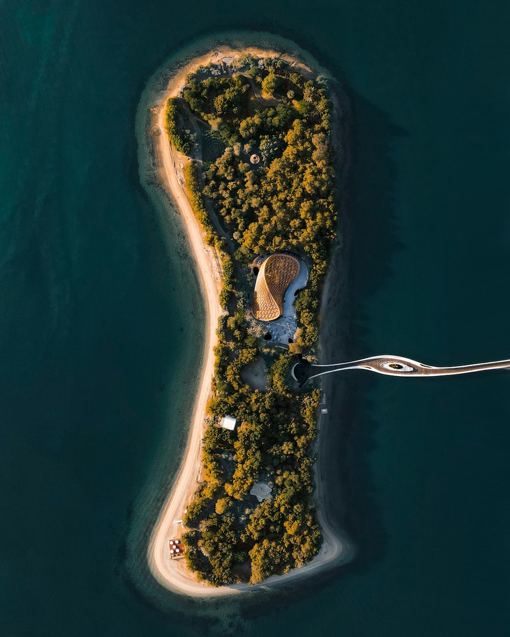 an aerial view of an island in the middle of the ocean