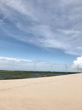 A serene landscape showcasing renewable energy sources like wind turbines and solar panels.