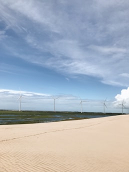 A serene landscape showcasing renewable energy sources like solar panels and wind turbines.
