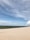 A serene landscape showing oil and gas facilities with greenery around.