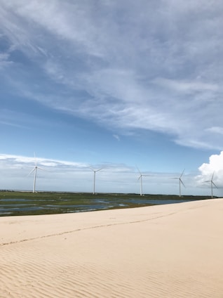 A serene landscape showcasing renewable energy sources like wind turbines and solar panels.