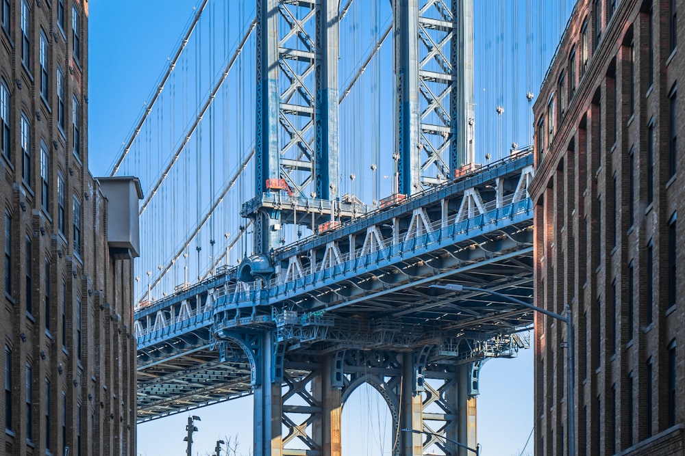 a large bridge spanning over a city with tall buildings