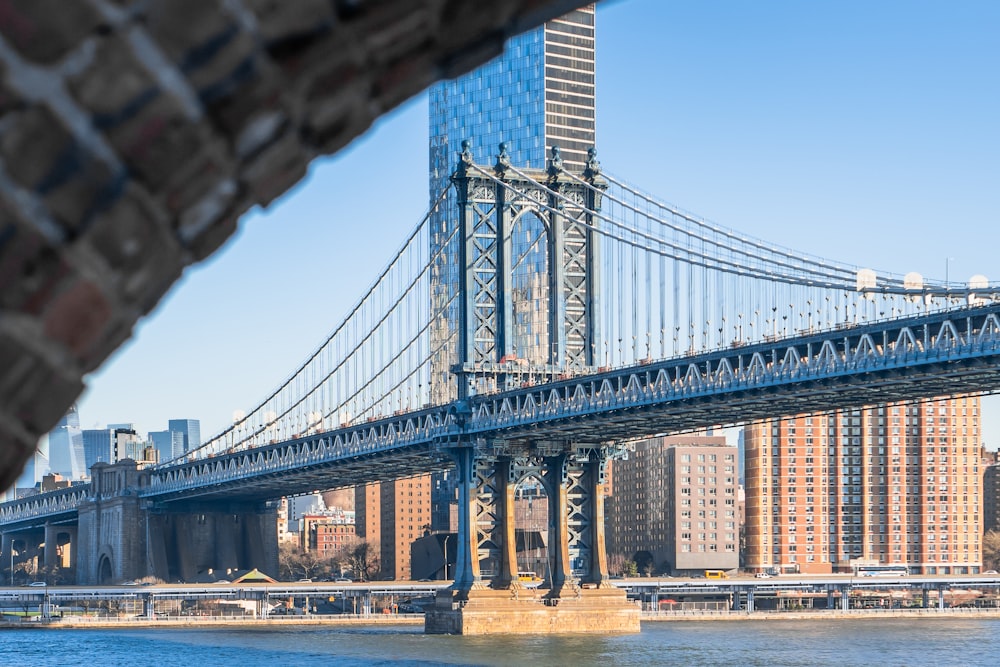 a view of the brooklyn bridge from across the river