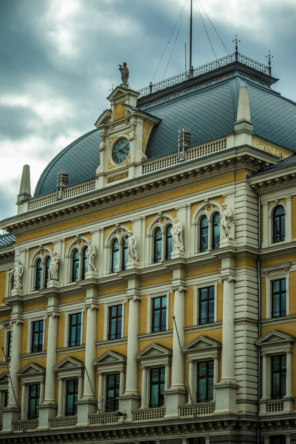 a large building with a clock on the top of it