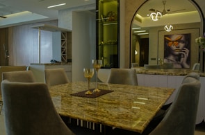 A marble dining table with a smooth surface and elegant design in a cozy room.