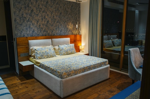 A cozy bedroom featuring custom furniture and subtle decorative accents.