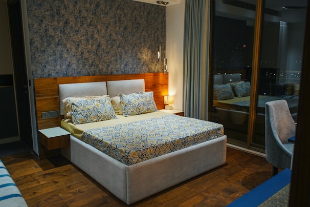 A cozy bedroom featuring a plush bed and tasteful decor accents.