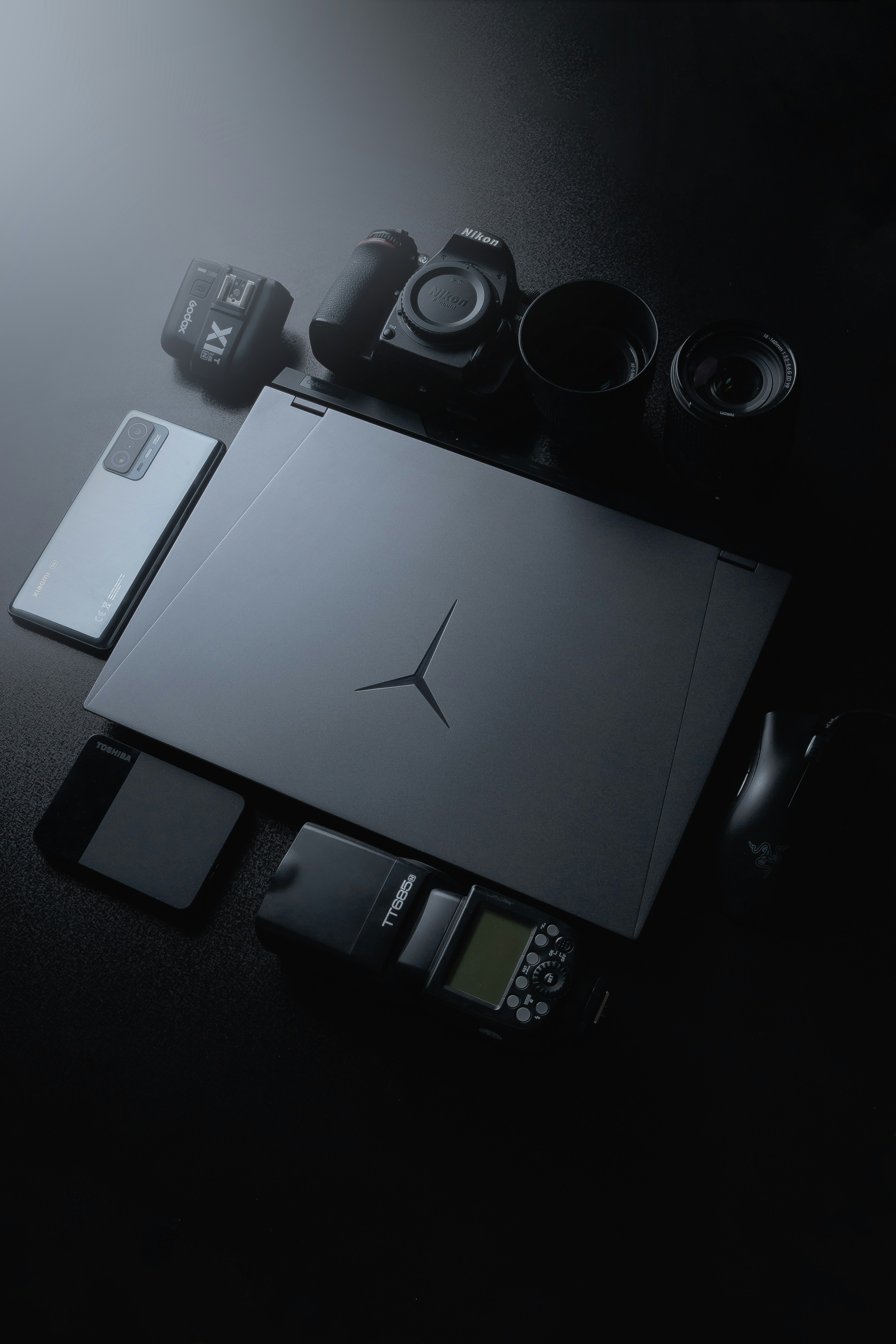 a black table topped with a laptop computer