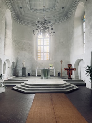 The serene interior of the church venue with choir members preparing.