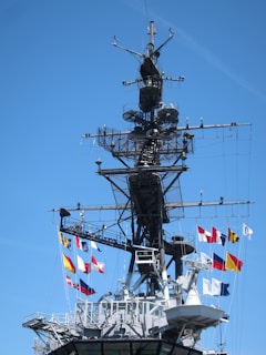 a large ship with a lot of flags on it