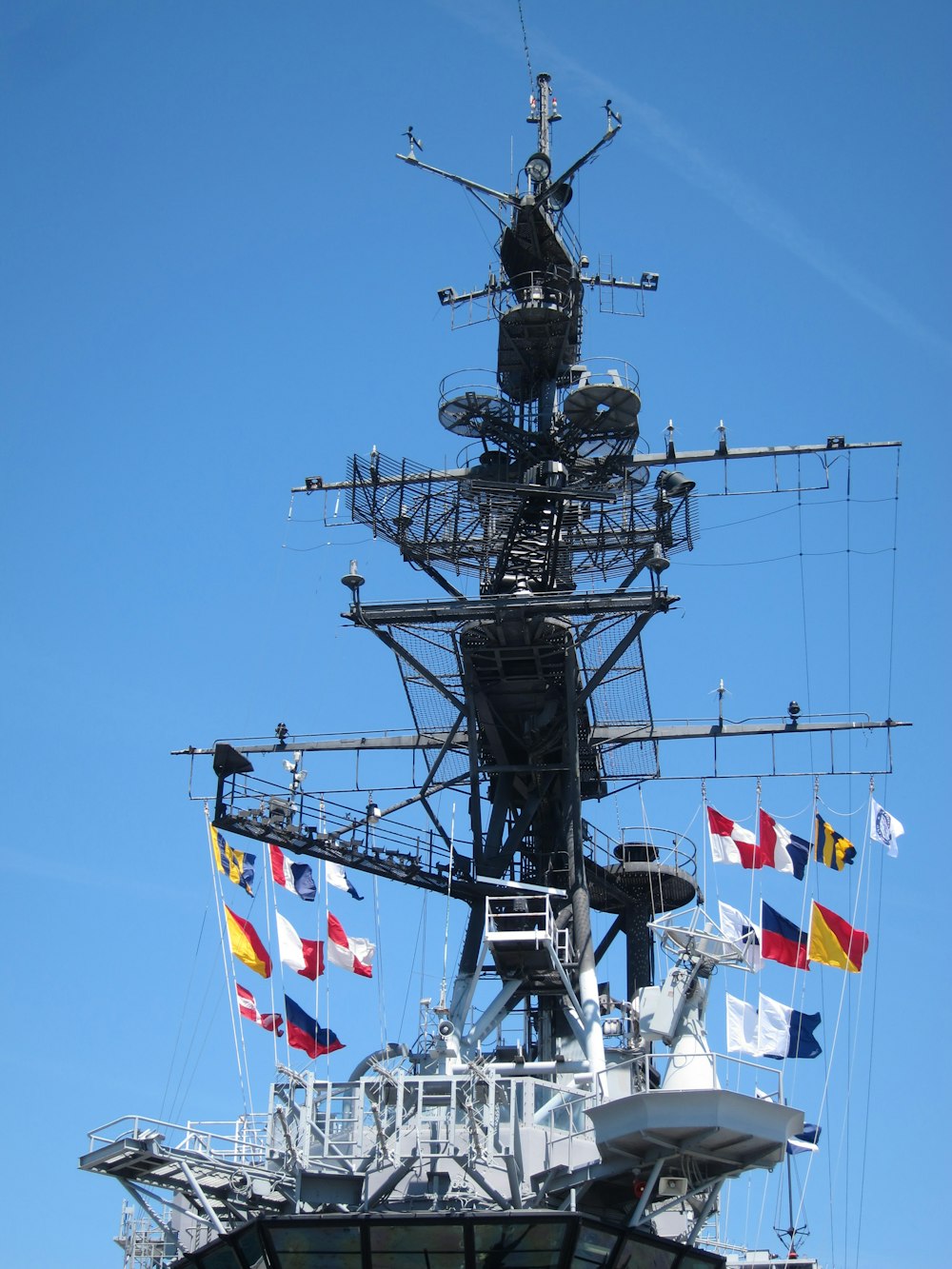 a large ship with a lot of flags on it