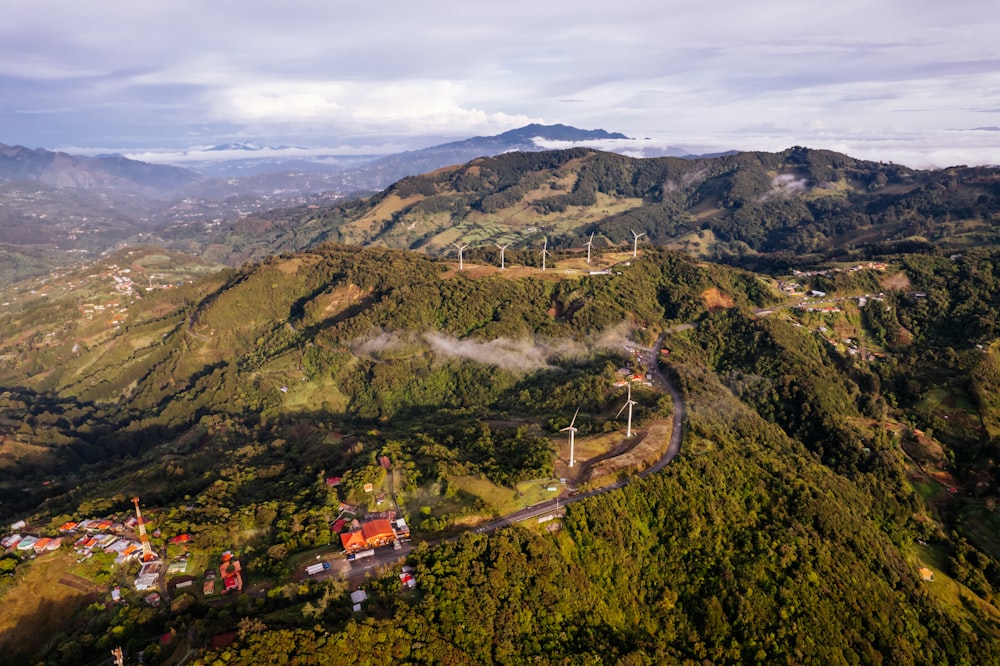 an aerial view of a mountain with a train on it