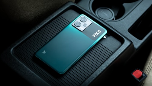 a close up of a cell phone in a car