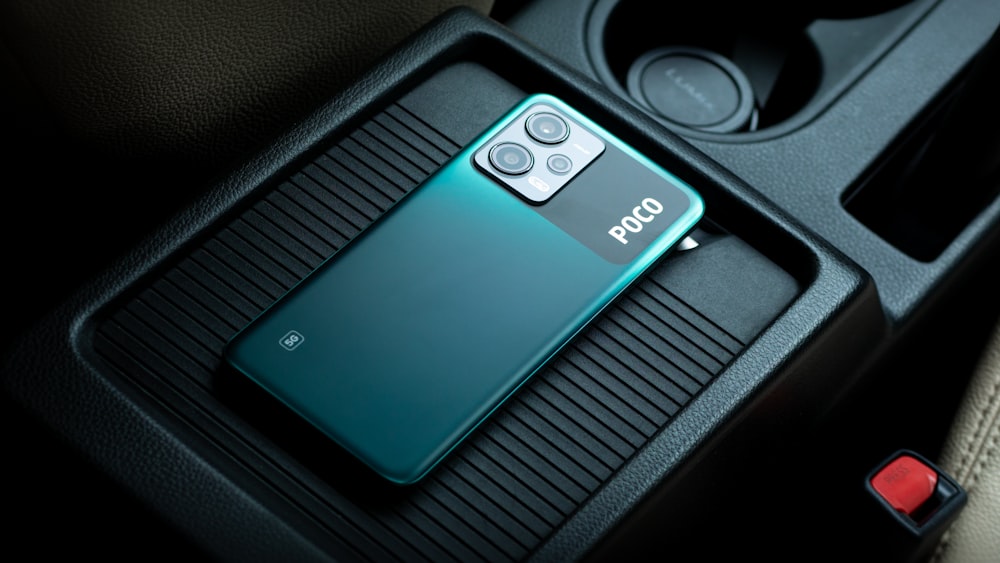 a close up of a cell phone in a car