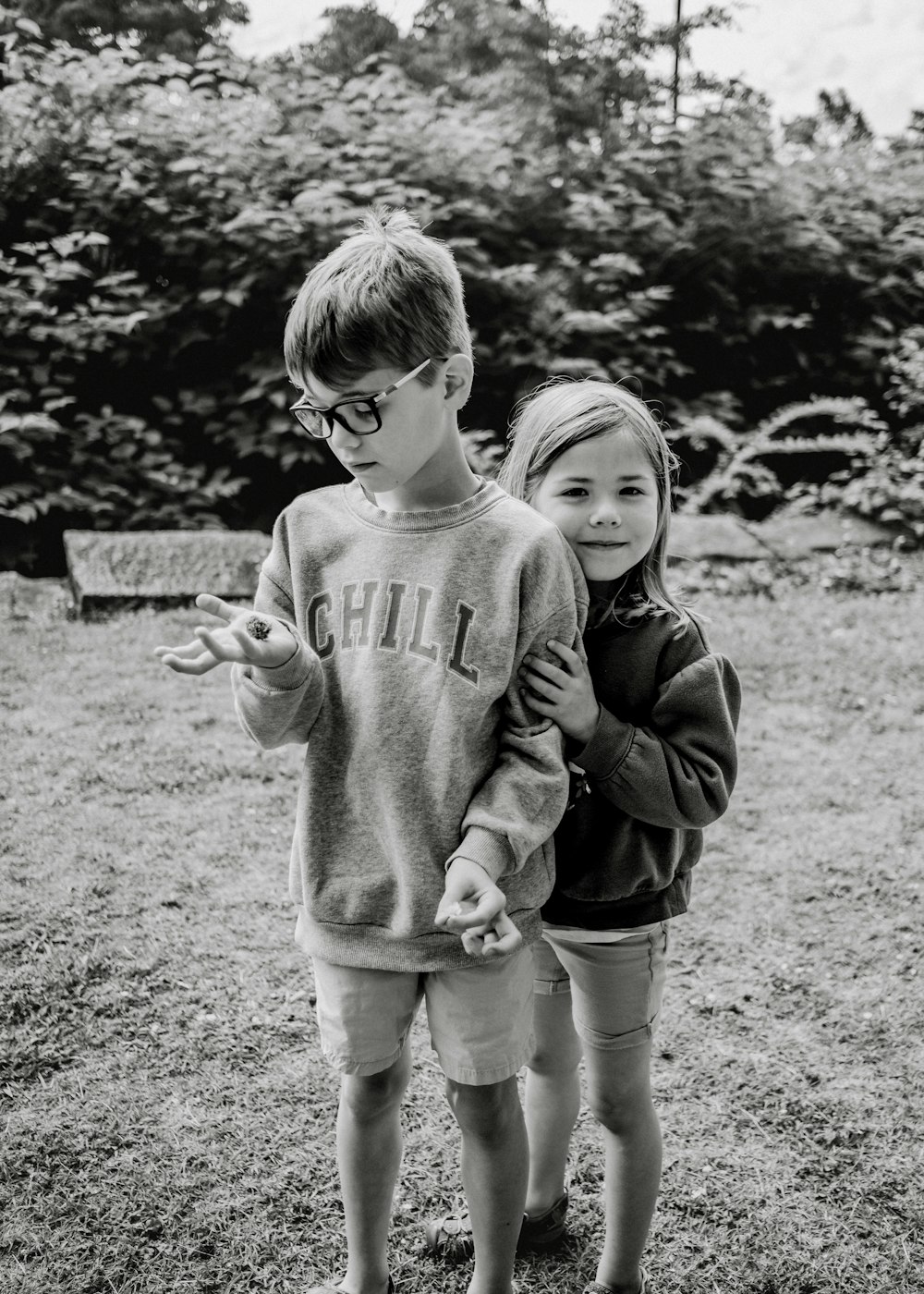 a boy and a girl standing next to each other