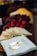Close-up of a beautifully arranged grazing table with fresh fruits, cheeses, and elegant decor.