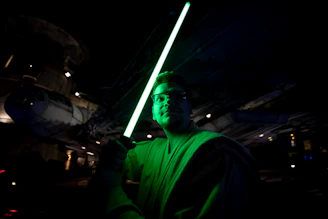 The workshop 'Jedi Temple' with minimalist black walls and neon green lightsaber glow accents.