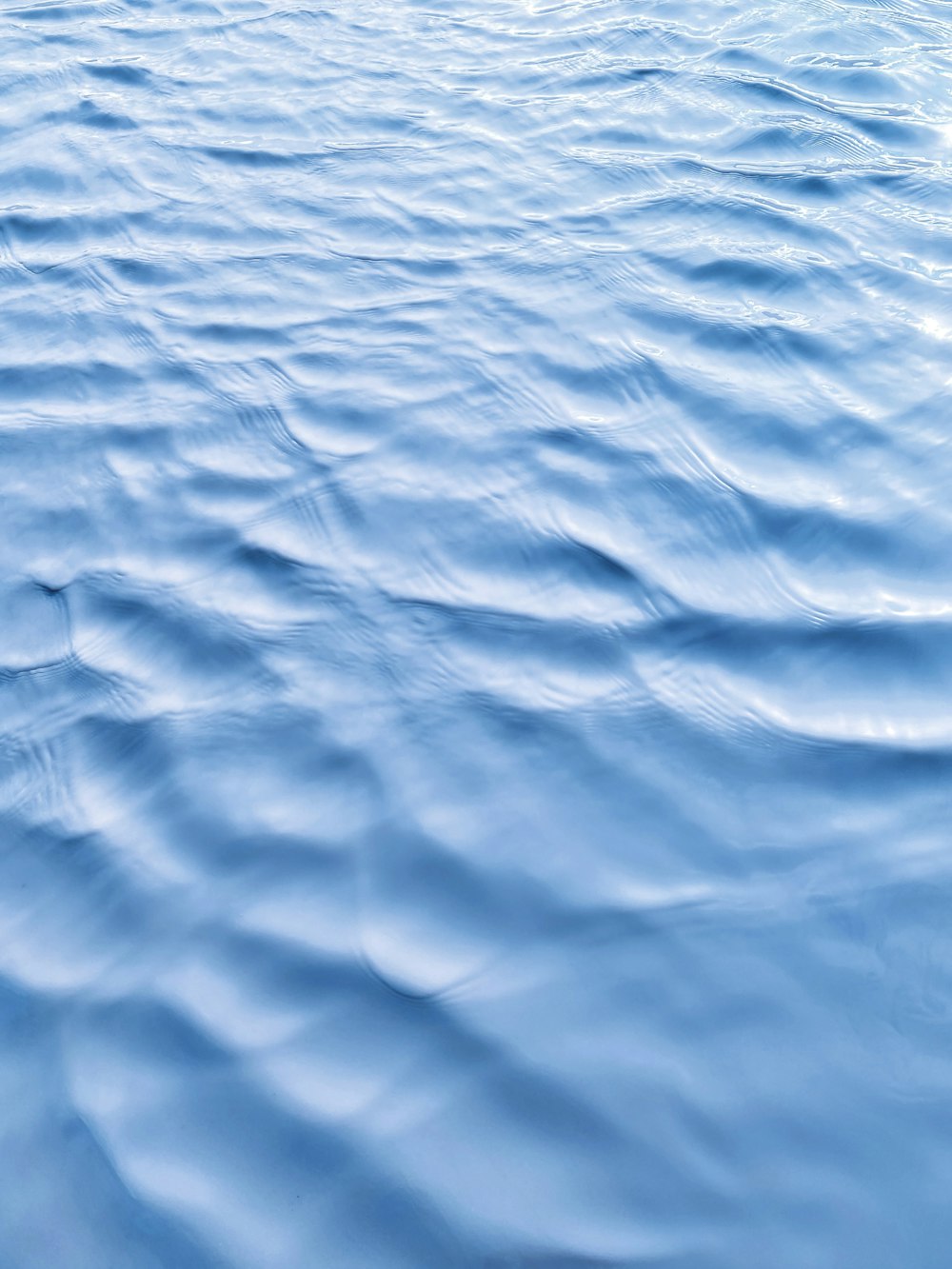 a large body of water with ripples on it