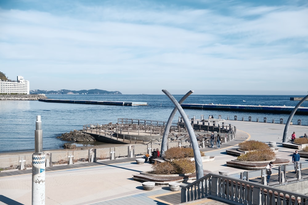 a large body of water sitting next to a pier