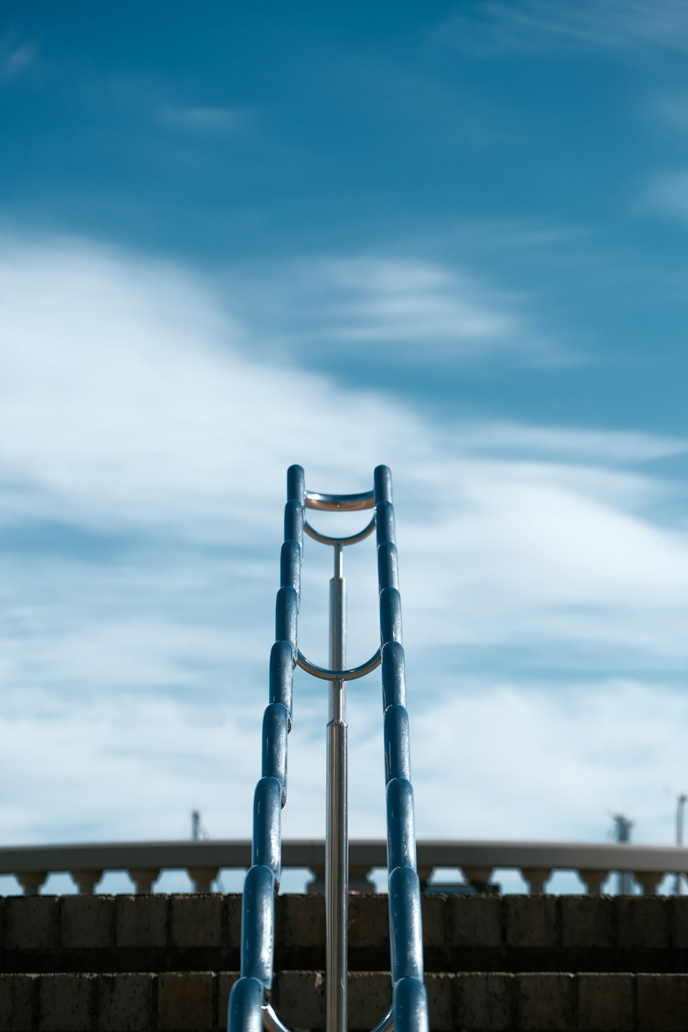 a metal structure with a sky in the background