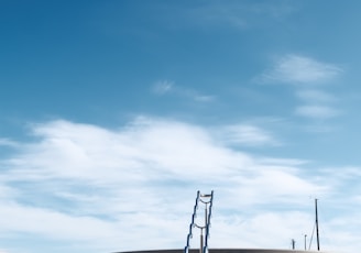 a set of steps leading up to a sky filled with clouds