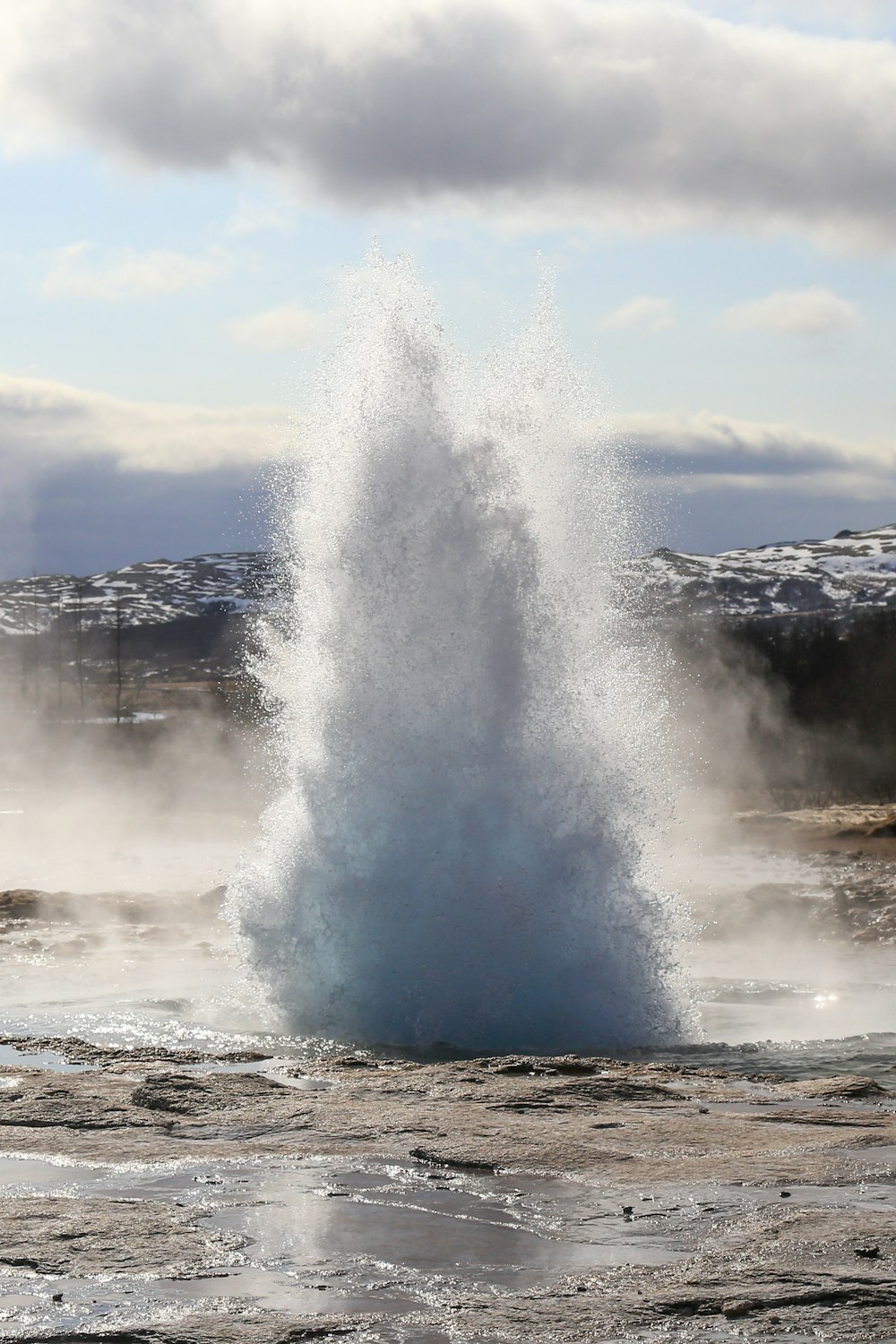 a geyser spewing out water into the air