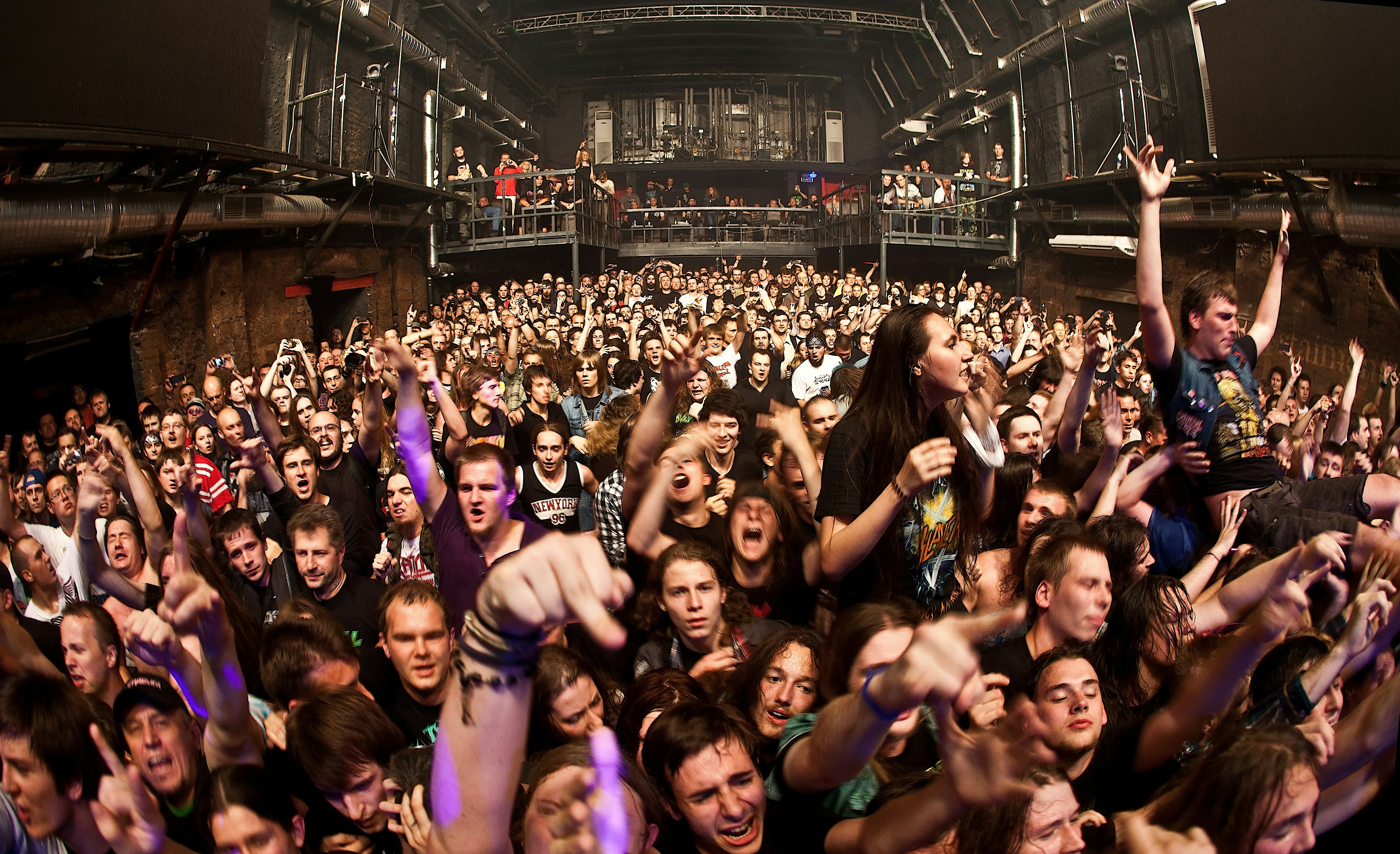 a large group of people at a concert, 