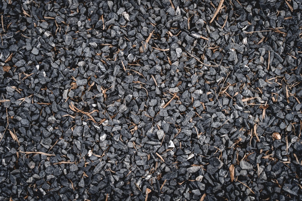 a close up of a pile of black rocks