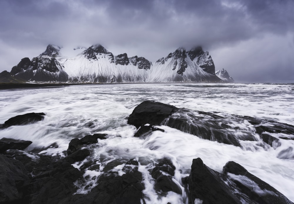 a large body of water surrounded by rocks