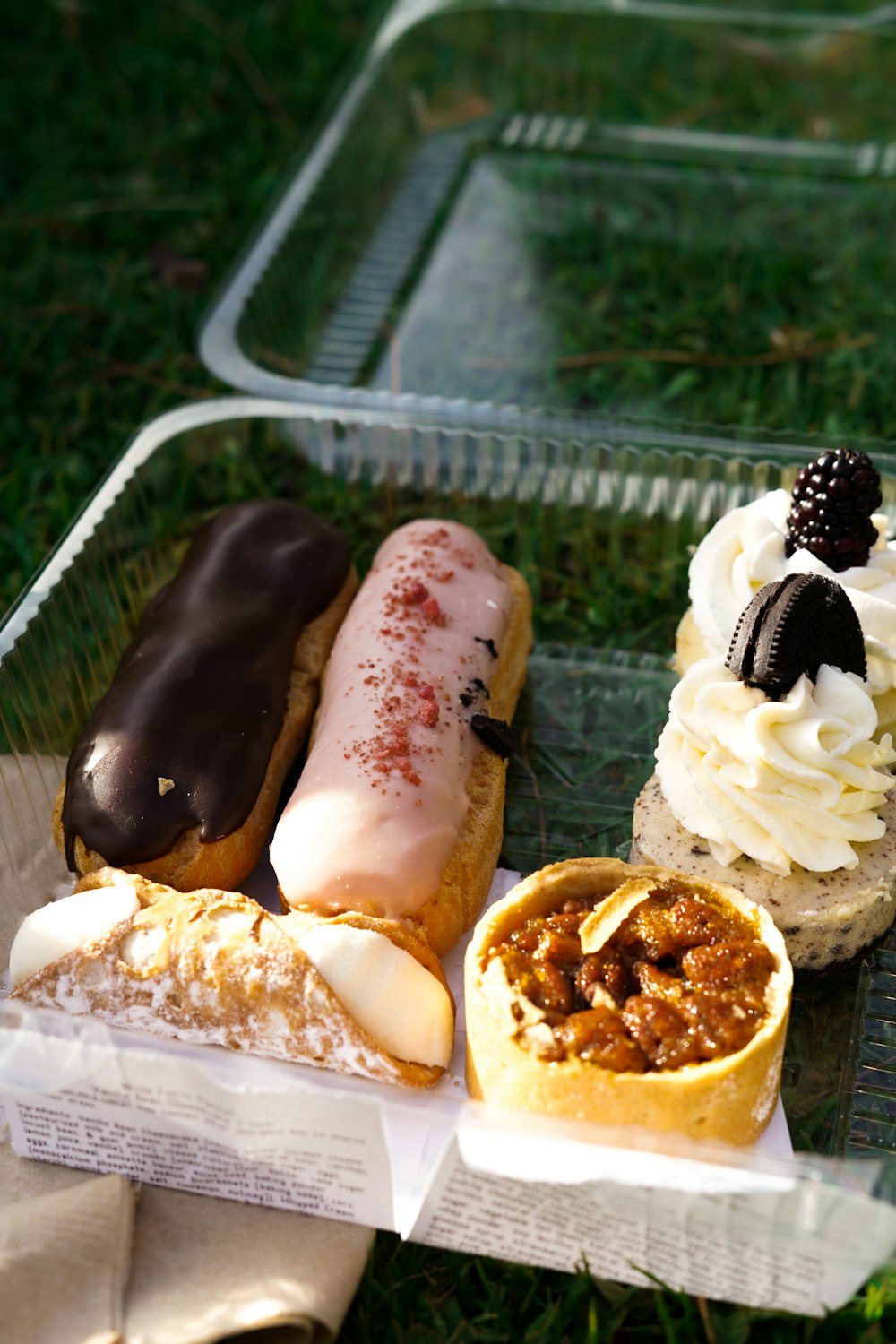 a plastic container filled with different types of pastries