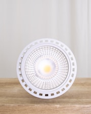 A close-up of various LED lighting products including bulbs and panels.