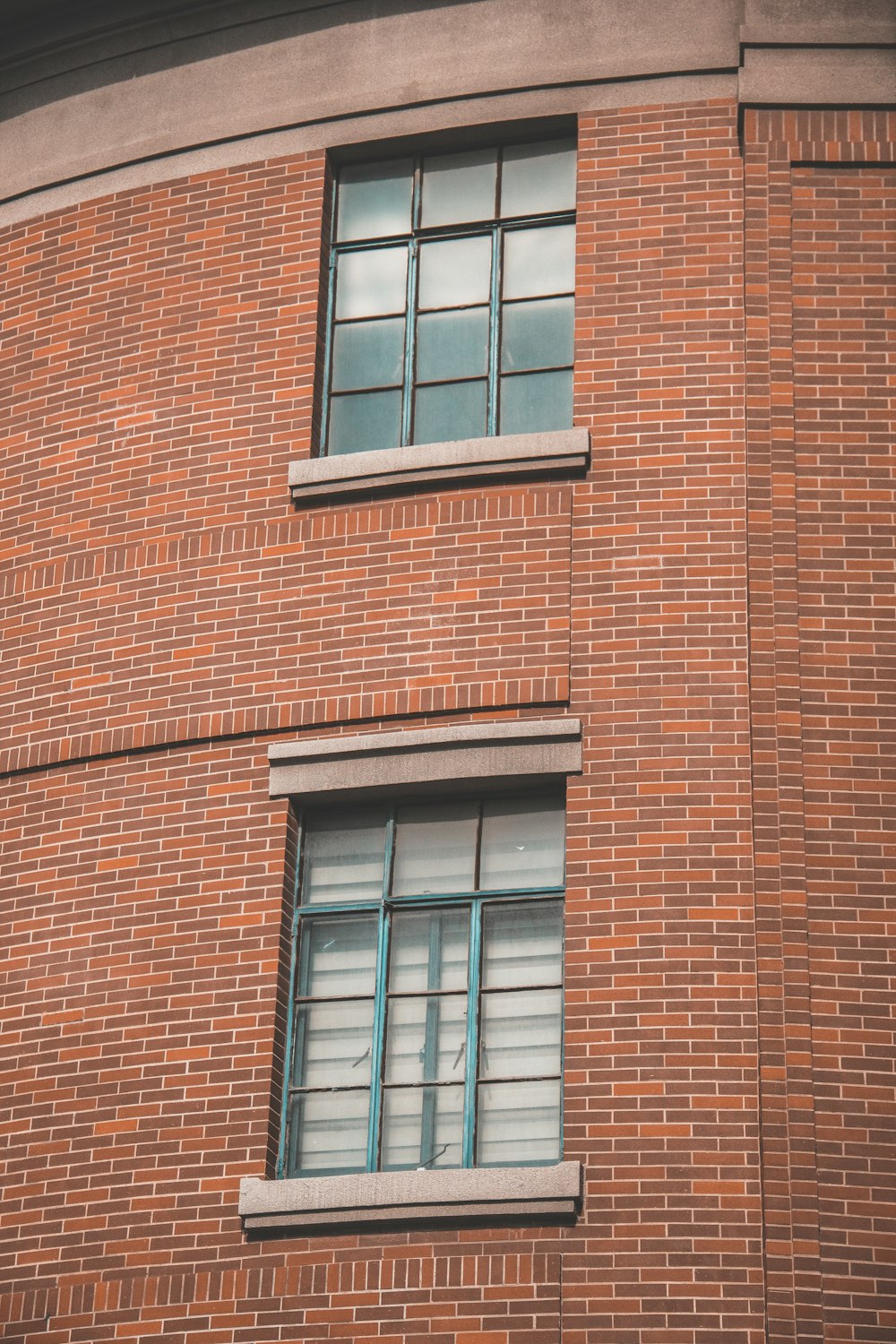 a red brick building with a clock on the side of it