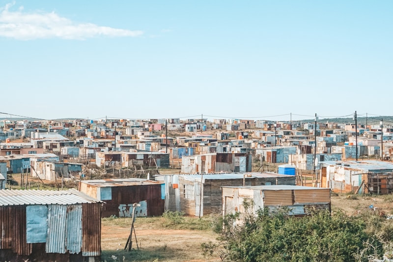 Sprawling informal settlement with corrugated iron shacks